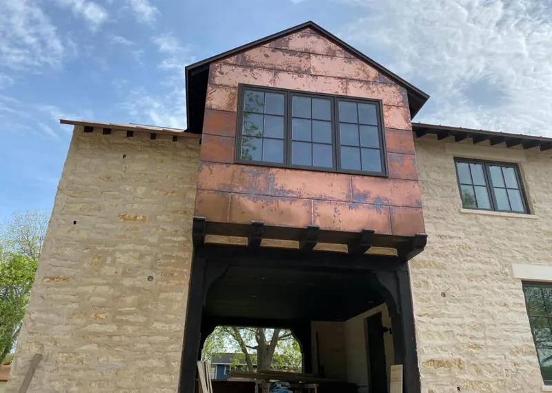 Copper metal panel facade on a stone building for Metal Roof Coating in Winthrop