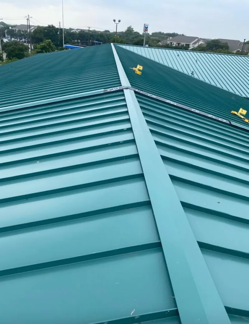 Green commercial metal roof ridge and valley for Metal Roof Repair in Winthrop